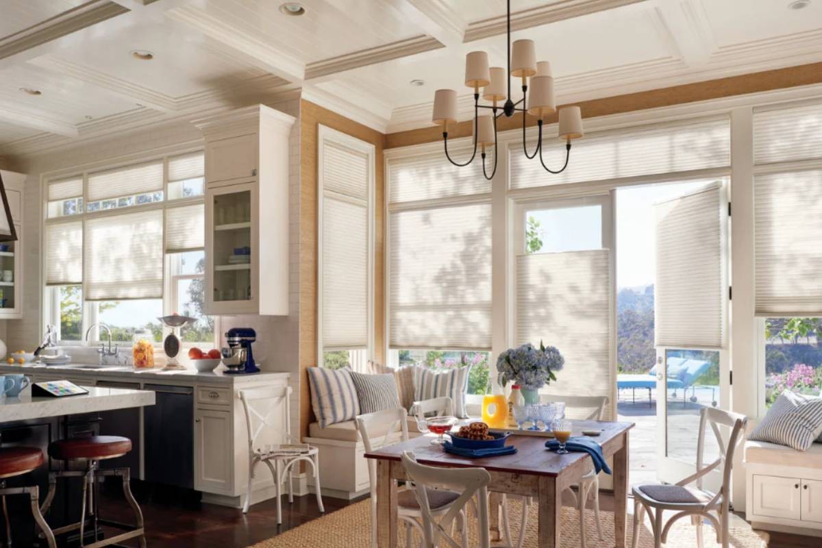 Hanging honeycomb shades in the kitchen to introduce insulation