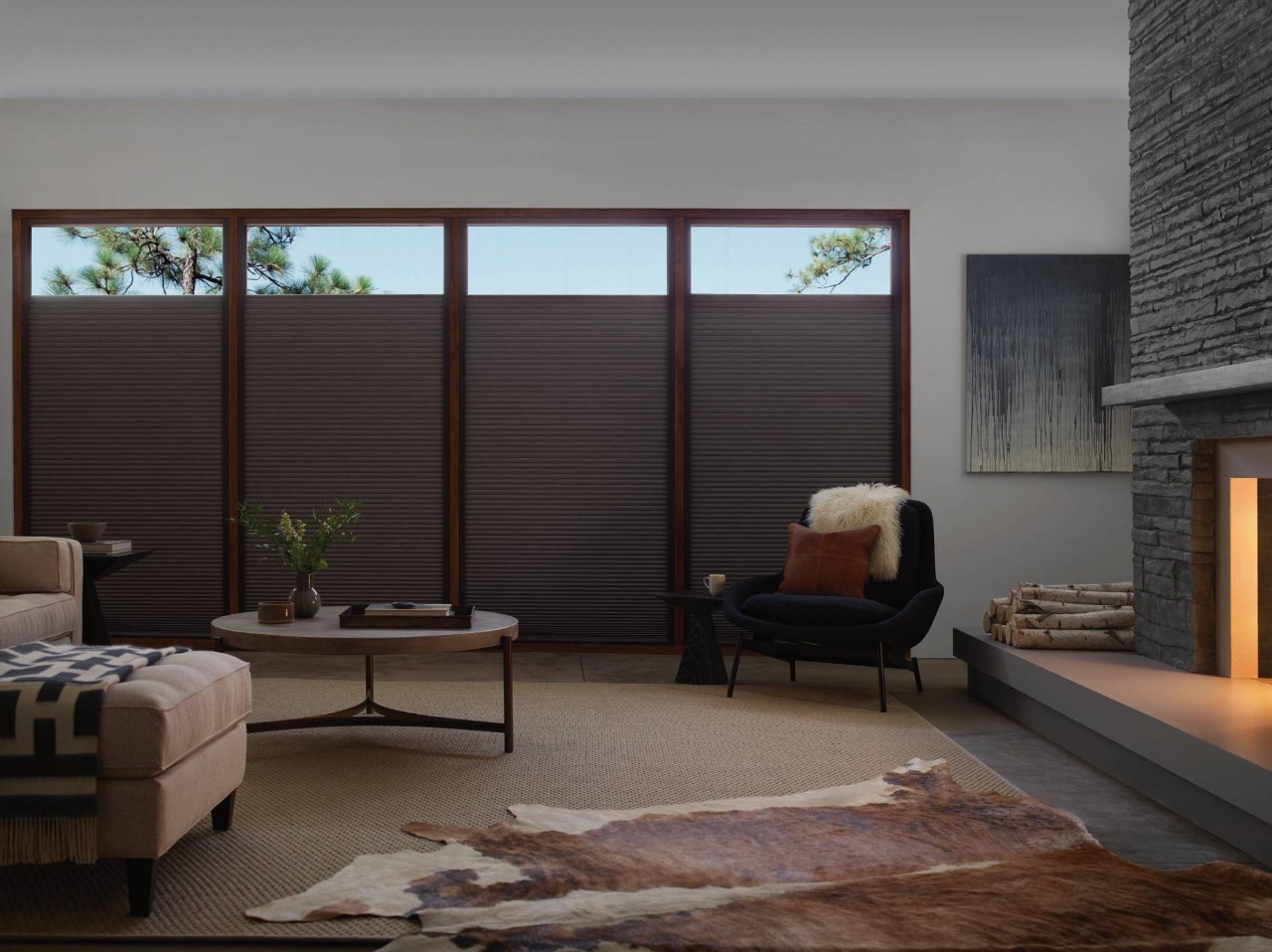 A living room decorated in neutral colors outfitted with Hunter Douglass Duette® Cellular Shades on the windows near Seattle, WA