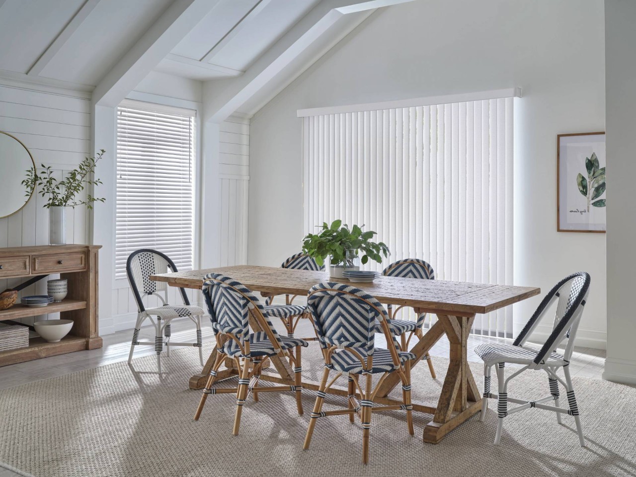 Bright and airy kitchen with a large window covered with Hunter Douglas Somner® Vertical Blinds at Wessco Blinds near Seattle, WA